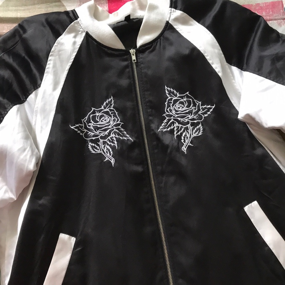 Black and white zip up jacket, no hoodie